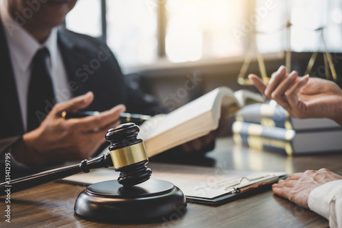 Papier peint Businesswoman and Male lawyer or judge consult having team meeting with client,