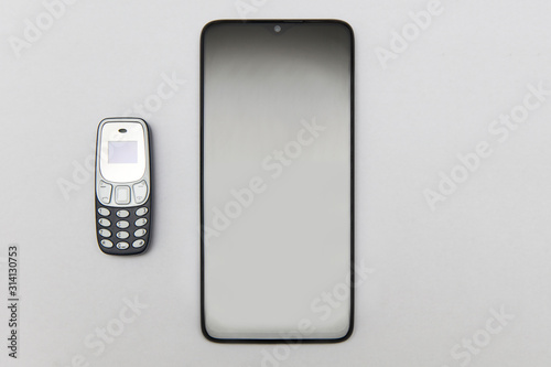 A modern smartphone and a o...