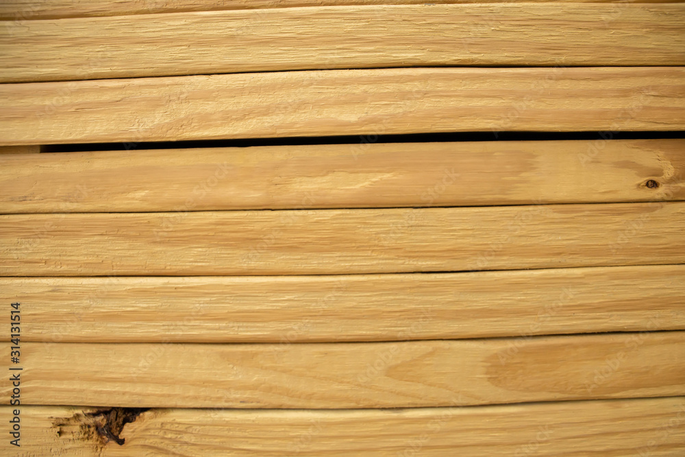 Fototapeta premium Large stack of pine wood planks at a home improvement store