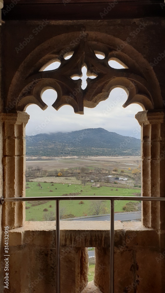 Arched window overlooking the landscape nature park  V