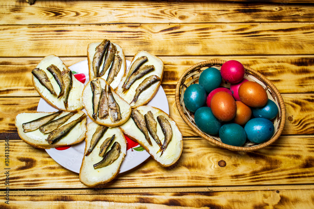 easter eggs and sandwiches on the table, selective focus