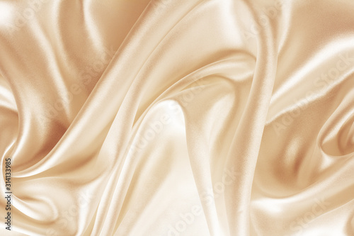 golden silk, satin fabric with large folds, abstract background