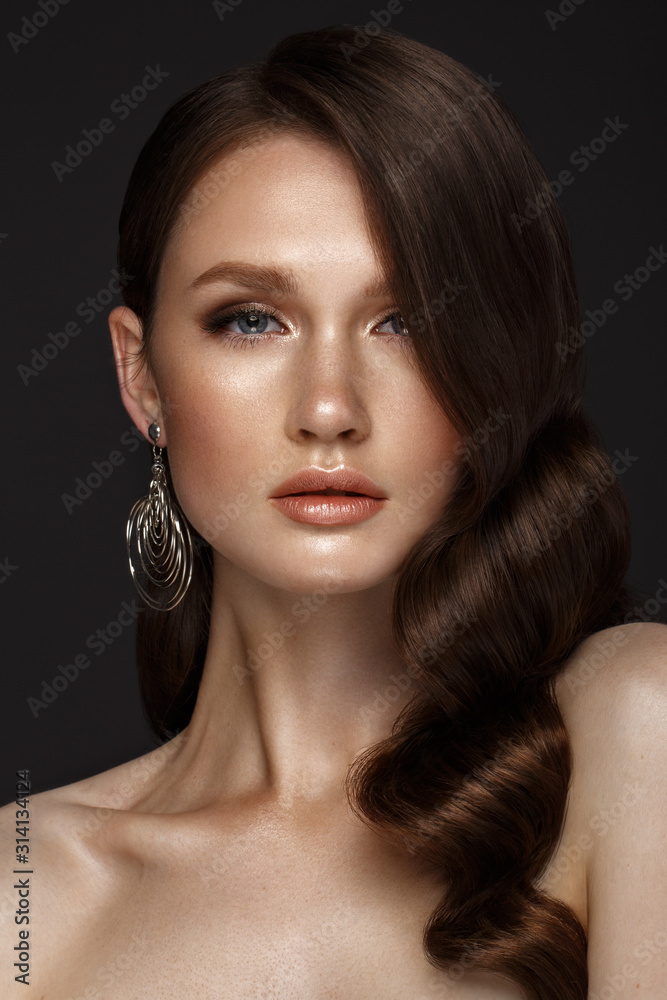 A beautiful girl with evening make-up, a Hollywood wave . Beauty face. A beautiful girl with evening make-up, a Hollywood wave . Beauty face.