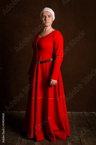 Beautiful sophisticated girl actress in a medieval costume of the 14th century central Europe. Hobby - reconstruction of historical events.
