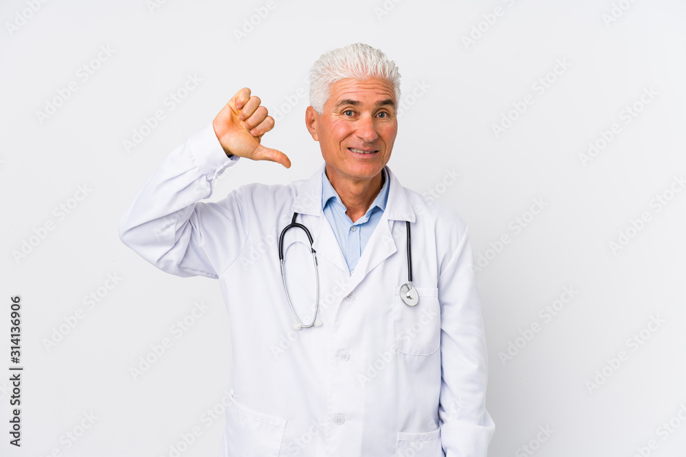 Mature caucasian doctor man showing a dislike gesture, thumbs down. Disagreement concept. Mature caucasian doctor man showing a dislike gesture, thumbs down. Disagreement concept.
