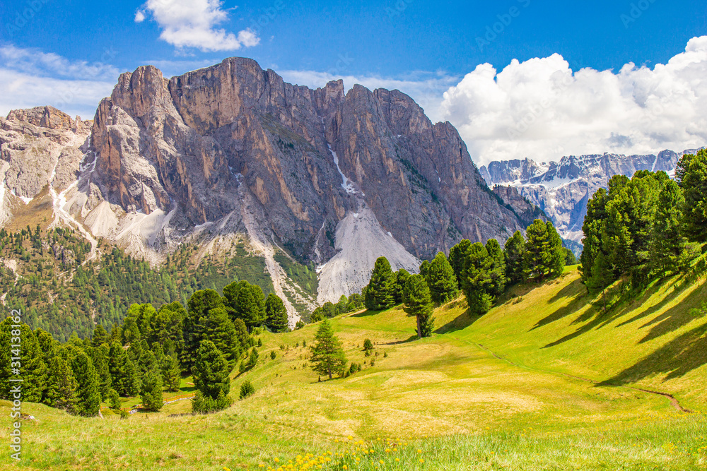 Obraz premium Amazing view from Seceda park. Selva di val gardena, Trentino Alto Adige, Dolomites Alps, South Tyrol, Italy Europe. panoramic on Odle - Geisler mountain group, Secede peak and Seiser Alm (Alpe Siusi)