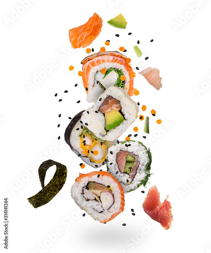 Pieces of delicious japanese sushi frozen in the air. Isolated on white background photo