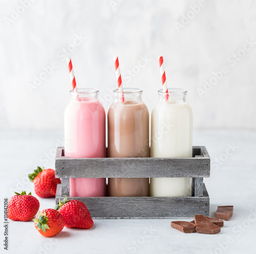 Three bottles of flavoured milk.