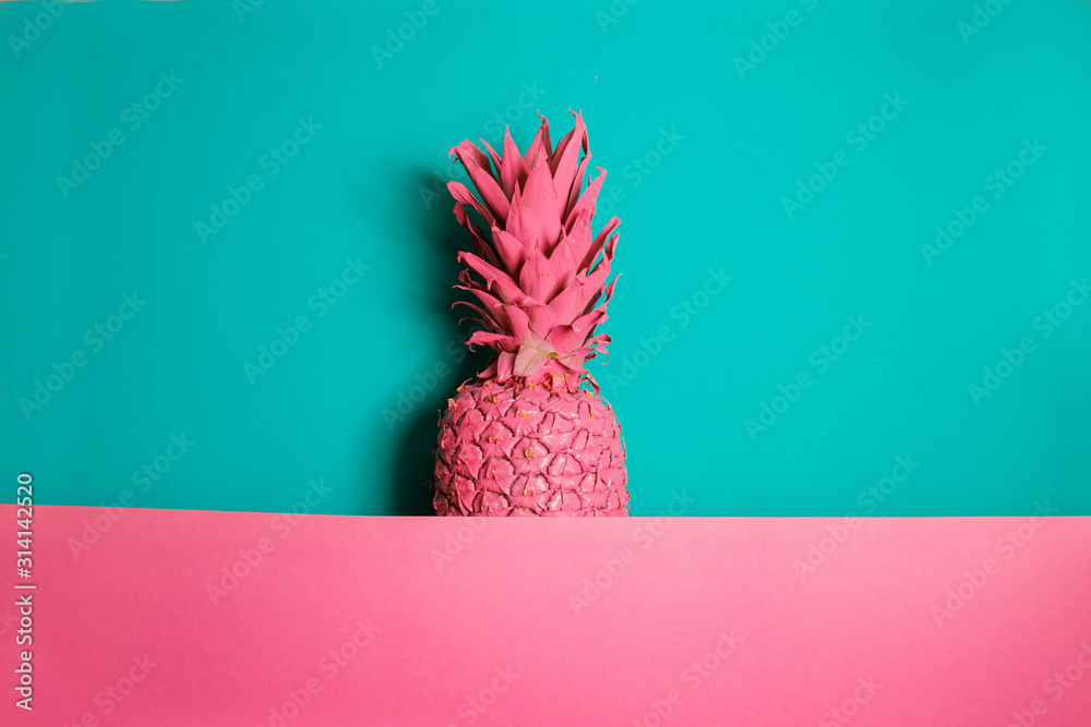 Fototapeta Color pineapple on pink and blue background. Surreal minimalistic art