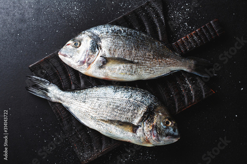 Fresh dorado fish with ingredients