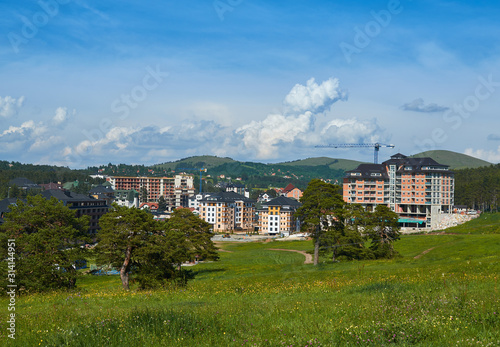 Center of Zlatibor village with houses during construction works in Serbia photo