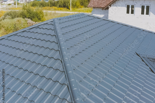 Corrugated metal roof and metal roofing. Modern roof made of met