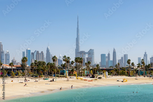 Dubai view of La Mer beach  people relax  in the distance the skyscrapers of the city. The United Arab Emirates Dubai March 2019