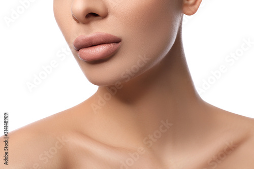 Woman with pink lipstick on white background, closeup