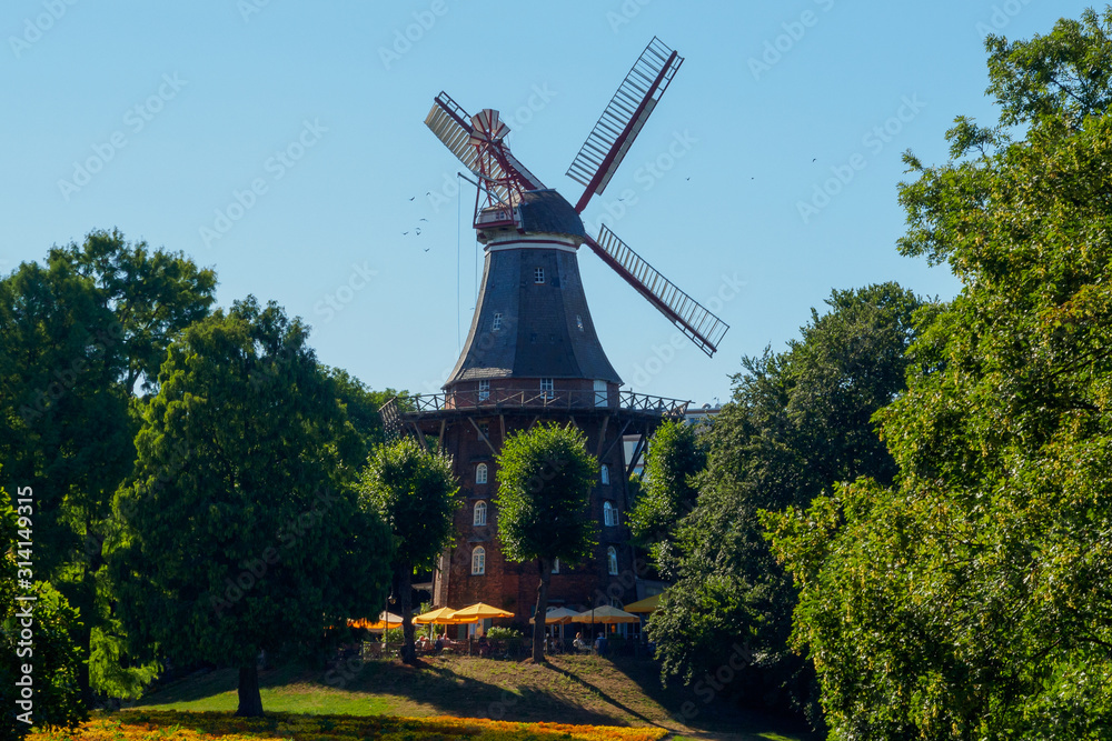 Am Wall Windmill near a river in Bremen, Germany