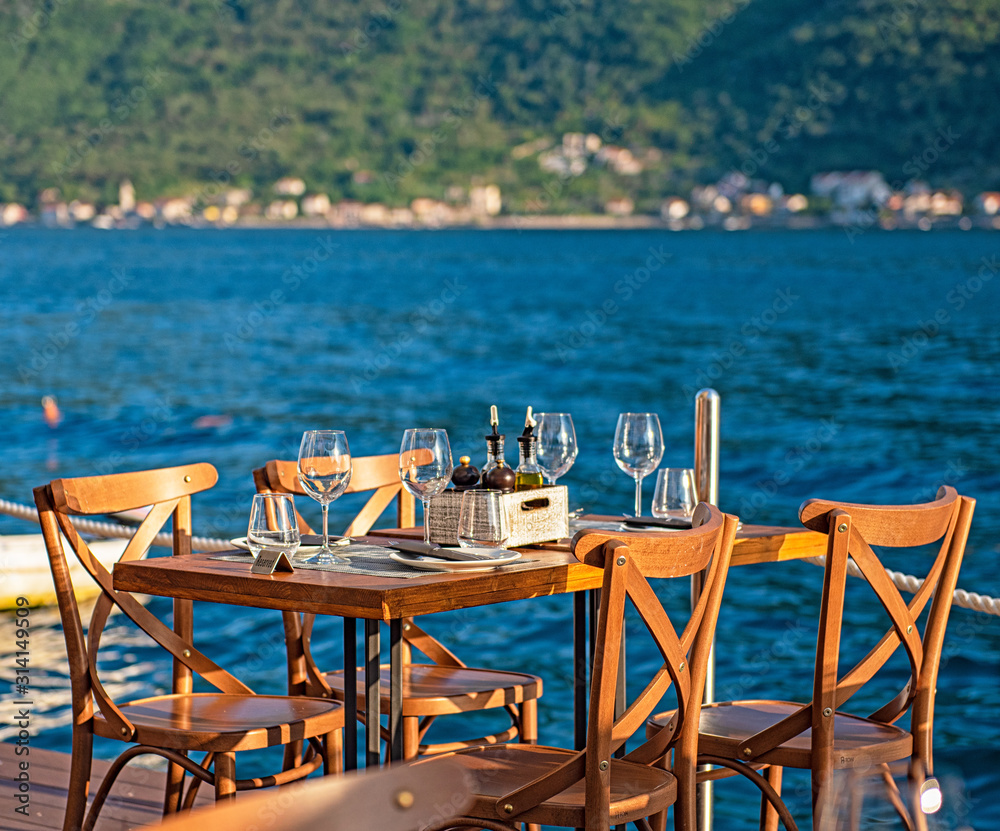 Beautiful restaurant at the sea, afternoon, eating out concept