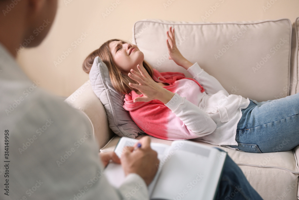 Professional psychotherapist working with patient in office Professional psychotherapist working with patient in office