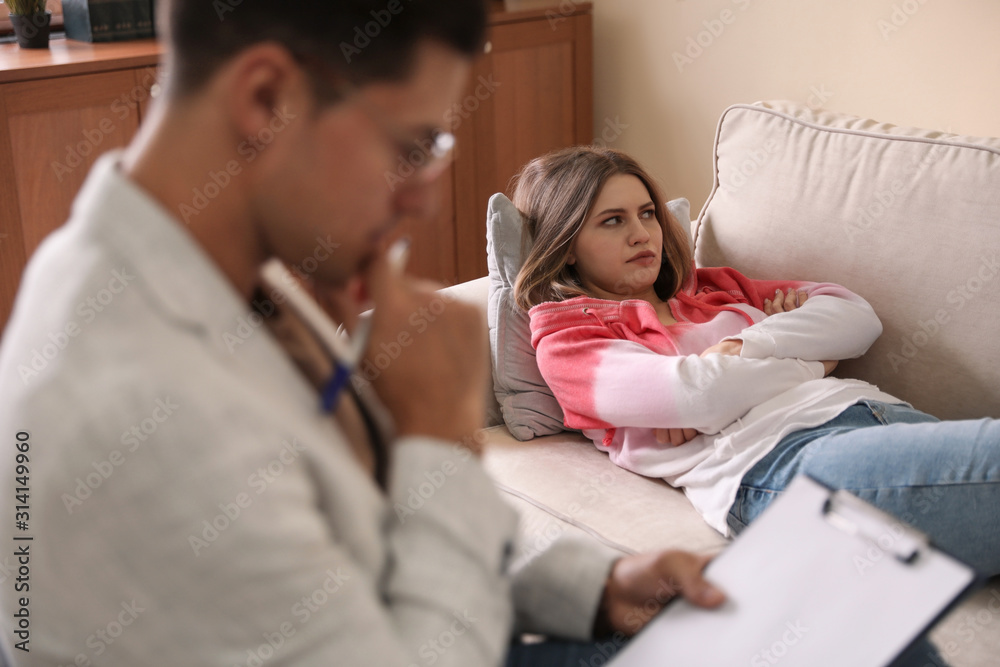 Professional psychotherapist working with patient in office Professional psychotherapist working with patient in office