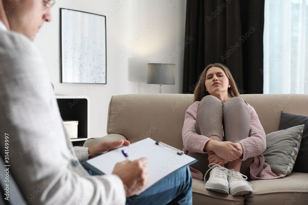 Professional psychotherapist working with patient in office Professional psychotherapist working with patient in office