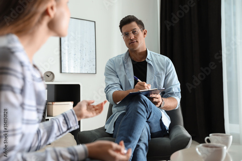 Professional psychotherapist working with patient in office