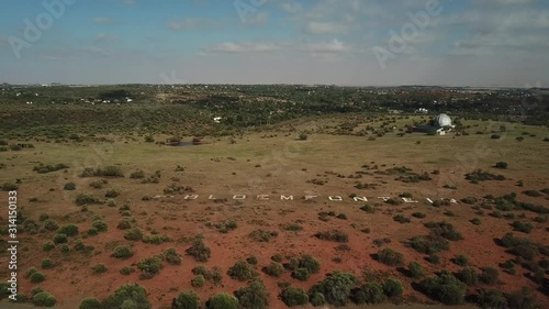 4K summer day aerial video Bloemfontein Naval Hill Planetarium Boyden Observatory, White Horse sculpture of Anglo Boer War days. Hill forms part of Franklin Game Reserve in Free State, South Africa photo