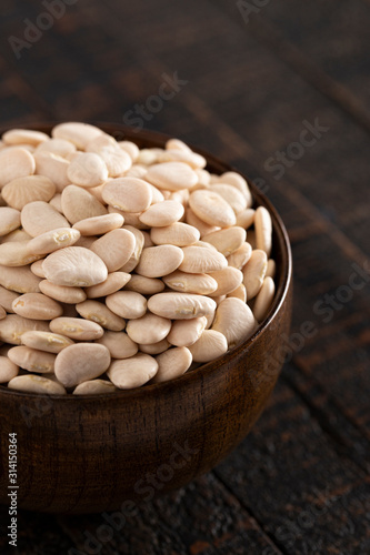 Bowl of Baby Lima Beans or Butter Beans on a Rustic Wooden Table photo