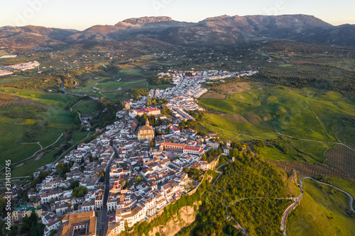 Aerial view of Ronda village  a village with white houses at the edge of cliffside in Andalusia  Spain