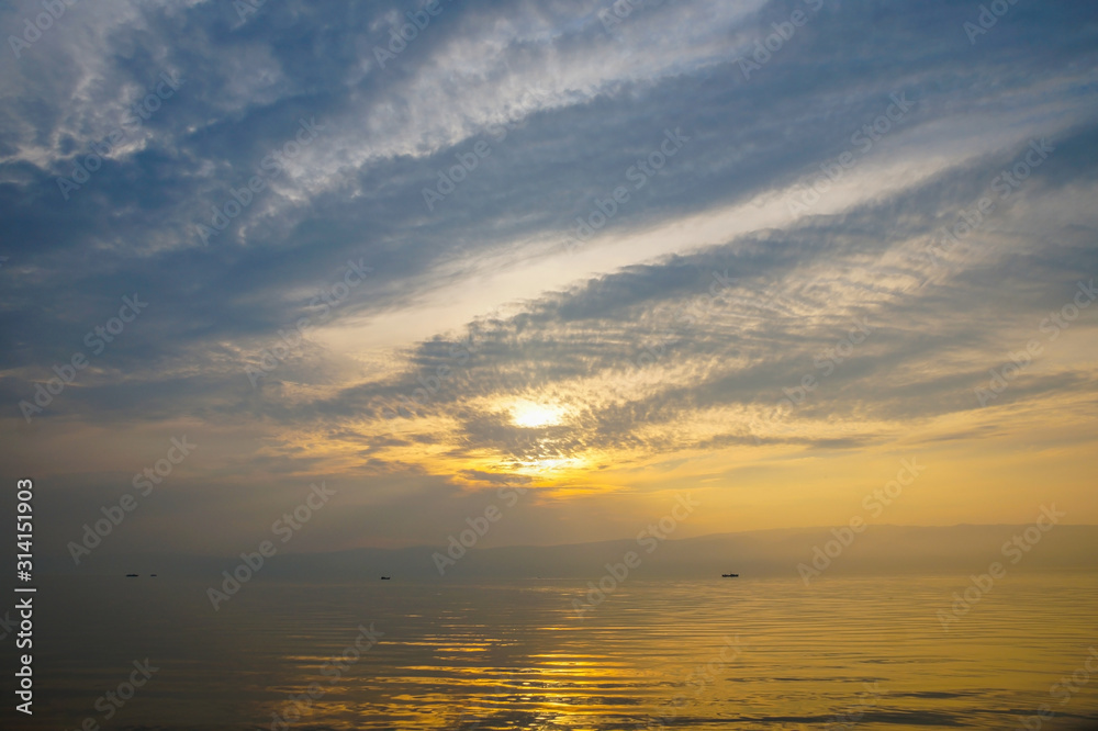 Obraz premium gorgeous Golden super sunset on a blue calm lake