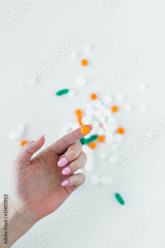 Woman holding prescription pills in hands photo