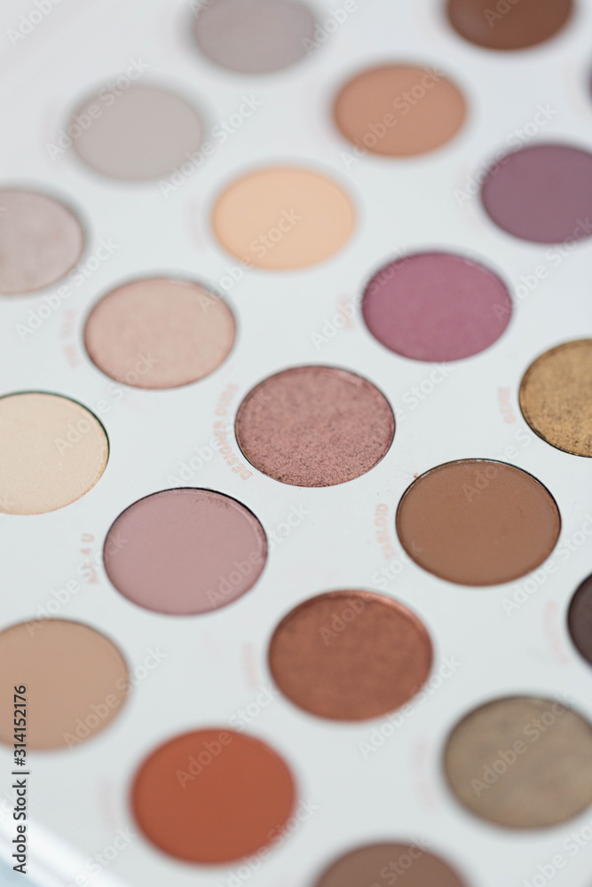 Fototapeta premium Neutral eyeshadow makeup palette on marble background