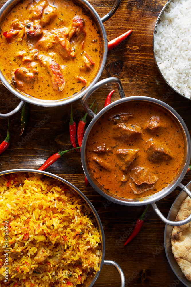 assortment of indian curries and rice dishes in flat lay composition assortment of indian curries and rice dishes in flat lay composition