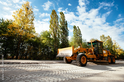 Schilderij op canvas Auto grader construction and road markings