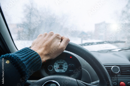 driving a car on a winter snowy day. Cold ride. © velimir