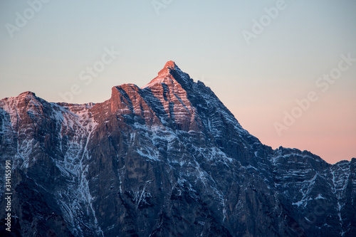 Mountain portrait Birnhorn Saalbach sunset purple light clouds snowy mountain