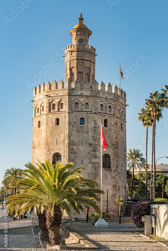 View of Golden Tower in Seville, Andalusia, Spain. Used as a military Moorish watchtower along the Guadalquivir river