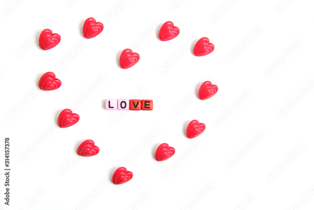 Red and pink heart beads shape - top view / flat lay with white background Red and pink heart beads shape - top view / flat lay with white background