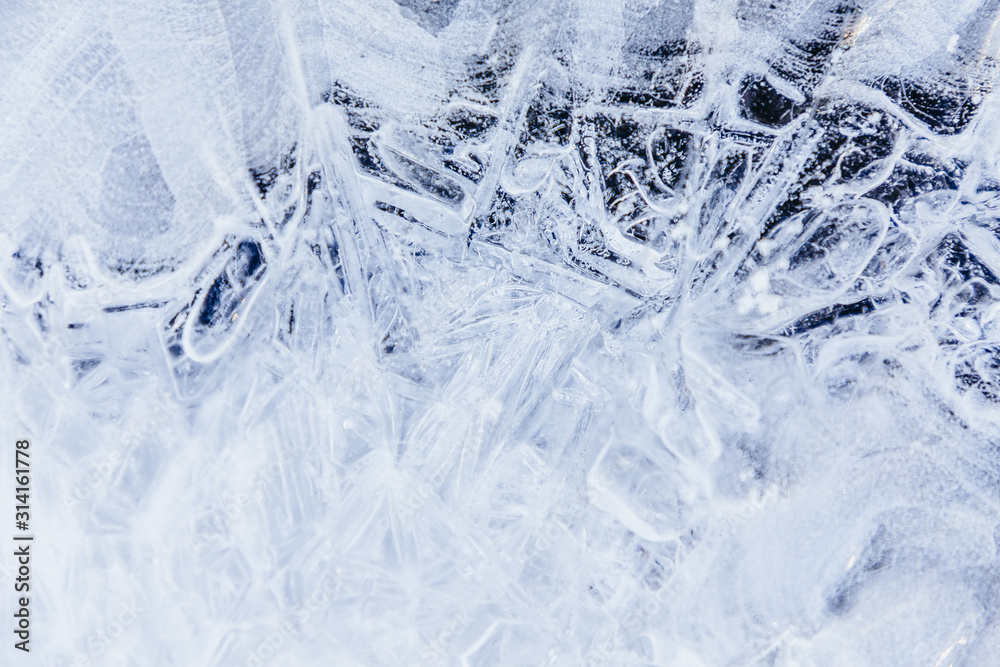 Ice texture, interesting frozen lake patterns, naturally created forms. Frozen river's water in the winter in mount Vitosha, near Sofia, Bulgaria. Ice Age climate changes. Ice texture, interesting frozen lake patterns, naturally created forms. Frozen river's water in the winter in mount Vitosha, near Sofia, Bulgaria. Ice Age climate changes.