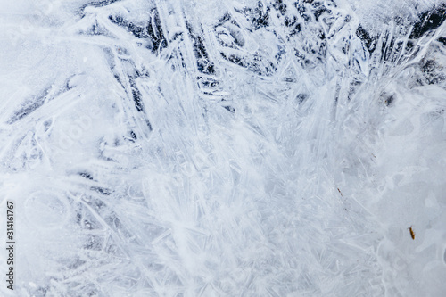 Ice texture  interesting frozen lake patterns  naturally created forms. Frozen river s water in the winter in mount Vitosha  near Sofia  Bulgaria. Ice Age climate changes.