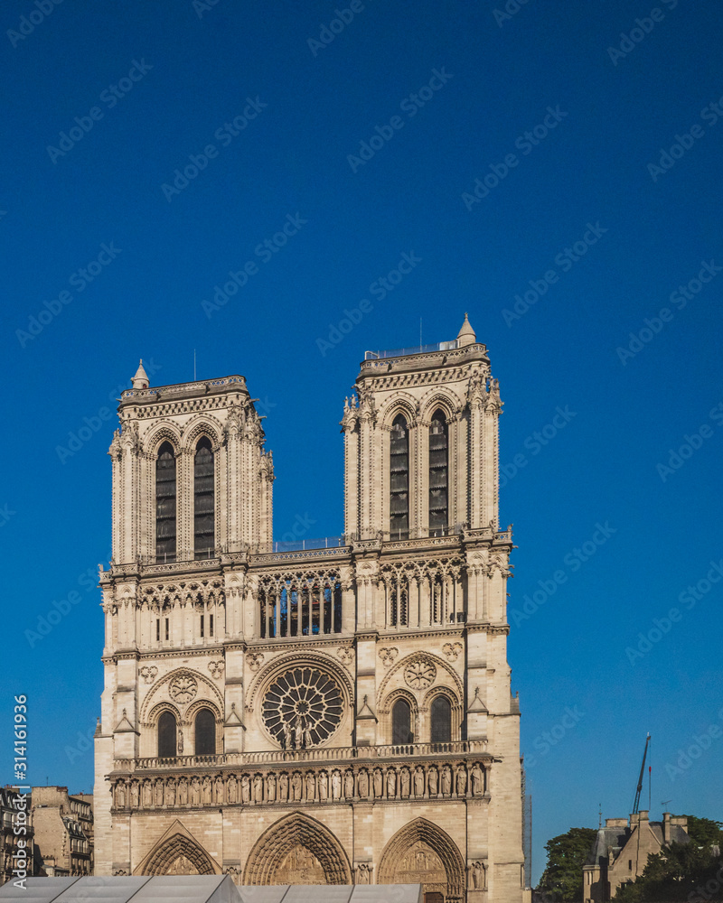 Notre Dame Cathedral under blue sky, in Paris, France