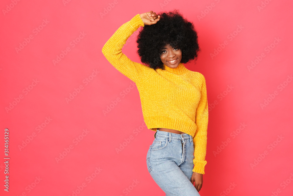 Happy afro-amercian girl in hello sweater isolated on red background. Happy afro-amercian girl in hello sweater isolated on red background.
