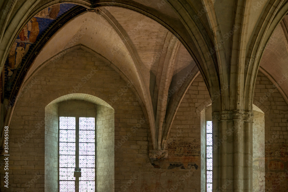 Gothic inner hall with vaults and mica windows of medieval Palace of Popes, Avignon, France