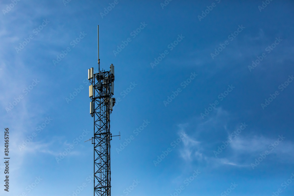 A single standard cell site tower in Canada. A steel frame tower houses electronic communications equipment. Telecommunications infrastructure A single standard cell site tower in Canada. A steel frame tower houses electronic communications equipment. Telecommunications infrastructure