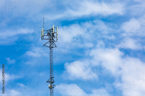 Canvas Print A low angle view of a cable stayed cellular base station, used in the triangulat
