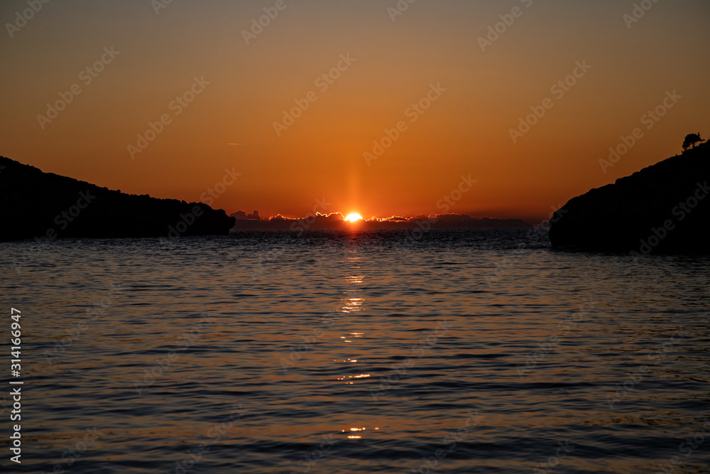 sunset on Voidokilia Beach a beautiful beach near Gialova Lagoon on Mediterranean sea. Pylos-Nestor, Messenia, Peloponnese, Greece
