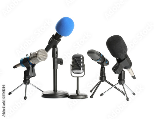 Set of different microphones isolated on white. Journalist's equipment