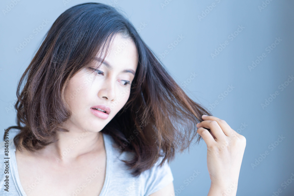 Woman serious hair loss problem for health care shampoo and beauty product concept, selective focus Woman serious hair loss problem for health care shampoo and beauty product concept, selective focus
