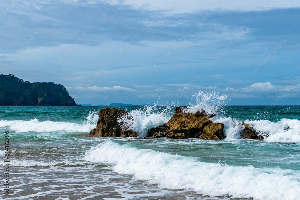 waves crashing on rocks