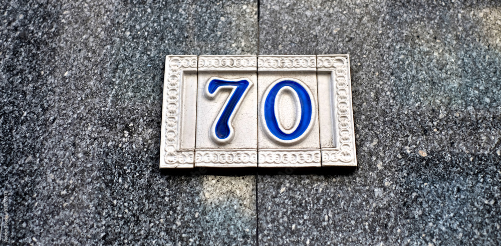 Number 70, seventy, blue decorative digits on tiles. Number 70, seventy, blue decorative digits on tiles.