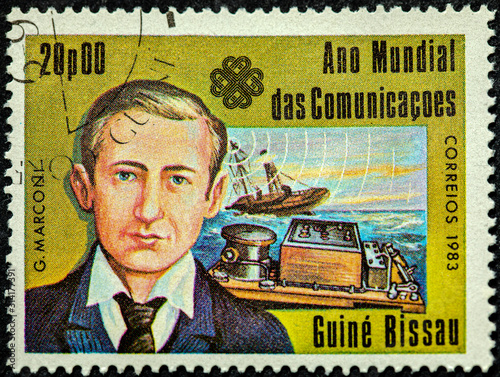 A stamp printed in Guinea-Bissau dedicated to the World Communications Year shows an Italian inventor and electrical engineer Guglielmo Marconi photo