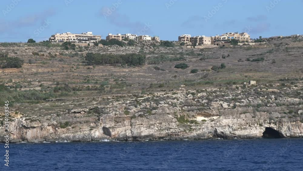 Gozo island in Malta in the Mediterranean Sea, panning shot from boat Gozo island in Malta in the Mediterranean Sea, panning shot from boat